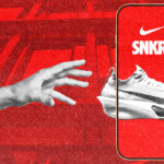 An arm reaching out to grab a white shoe inside of a red smartphone app